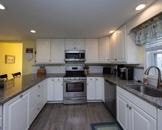 Nicely updated kitchen with pretty white cabinets - first floor unit