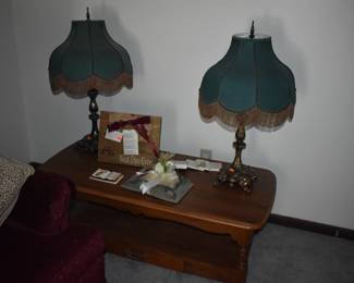 Featuring a Pair of lovely Scalloped Dome Umbrella Lamp shades complete with fringe and Beautiful Ornate Brass Bases atop a fine Vintage 2 Tier Coffee Table with drawer