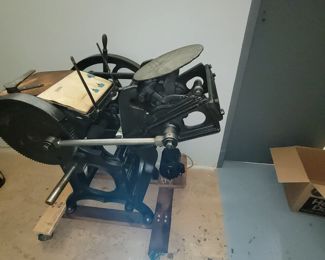 Antique printing press  large and heavy on wheels
