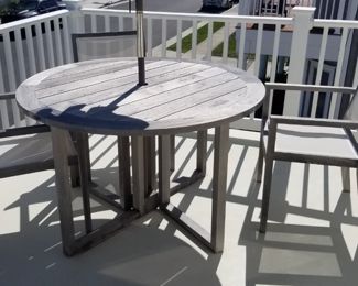 Outdoor dining set by Crate & Barrel seats 4