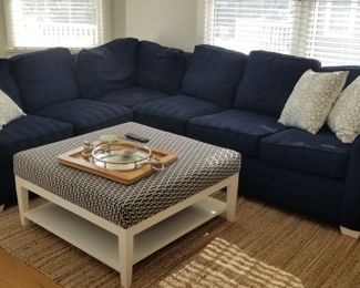 Navy sectional by Braxton Culler; ottoman/coffee table