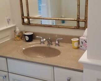 Pretty bath vanity; stylish mirror