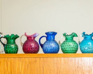 Fenton pitchers ( Blue coin, Cranberry, turquoise, topaz blue, forest green and more)