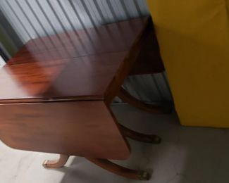 Restored Solid Wood Cherry Drop Down Table With 2 Leafs & Brass Leg Feet Covers Measures: Open 55.5"W x 38.25"D Closed 26"W Leafs 14"W x 38.25"D  $595