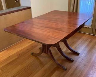 Restored Solid Wood Cherry Drop Down Table With 2 Leafs & Brass Leg Feet Covers Measures: Open 55.5"W x 38.25"D Closed 26"W Leafs 14"W x 38.25"D     $595