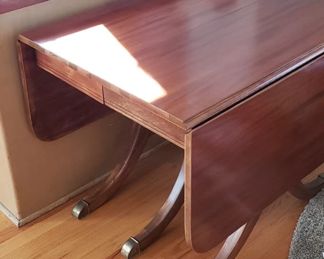 Restored Solid Wood Cherry Drop Down Table With 2 Leafs & Brass Leg Feet Covers Measures: Open 55.5"W x 38.25"D Closed 26"W Leafs 14"W x 38.25"D  $595
