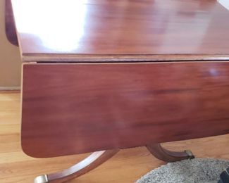 Restored Solid Wood Cherry Drop Down Table With 2 Leafs & Brass Leg Feet Covers Measures: Open 55.5"W x 38.25"D Closed 26"W Leafs 14"W x 38.25"D  $595