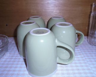 5 matching green mugs
