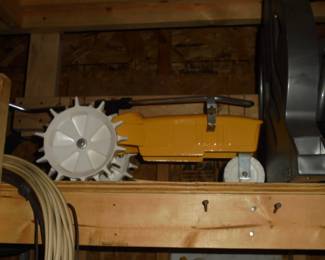 Yellow metal lawn sprinkler