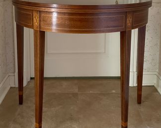 Caledonian Reproduction Mahogany Demi-Lune Flip-Top Game Table. Inlayed with Eagles. Measures 18"- 36" D x 29"H. Photo 1 of 4.