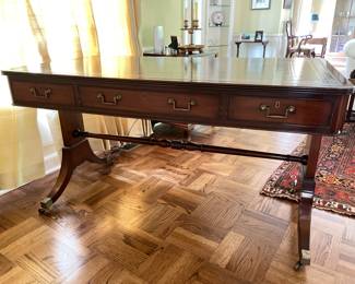 Caledonia English Reproduction Regency Style Mahogany Writing Table With Tooled Leather & Gilt Stenciled Top. Measures53" W x 30" D x 30" H. Photo 1 of 7.