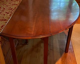 Cherry Drop Leaf Table. Measures 80" W x 50" D Fully Extended.