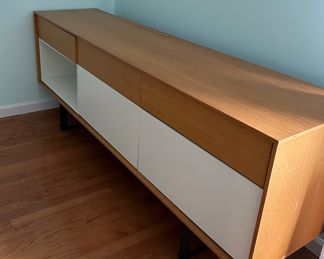Aura Credenza/Sideboard .  There is slight damage on the top back.  Priced as is.