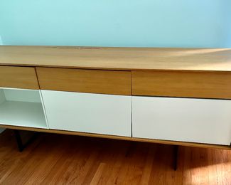 Aura Credenza/Sideboard .  There is slight damage on the top back.  Priced as is.