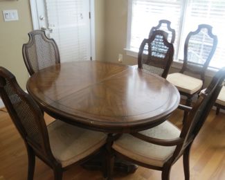 DINING ROOM TABLE WITH 6 CHAIRS AND 2 ADDITIONAL LEAVES.