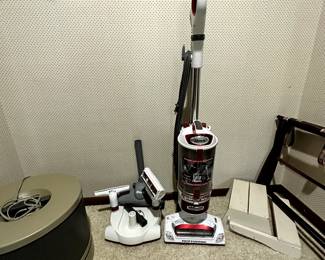 Bedroom closet - we all have one that looks just like this! Terrific usable items! This is a SHARK VACUUM WITH ACCESSORIES! 