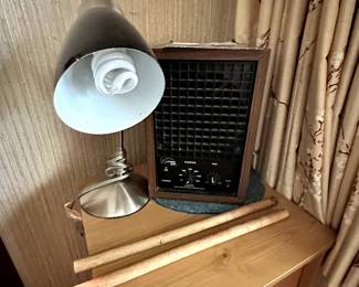 Nice corner dresser! Looks to be maple! On top, lamp and air purifier! 