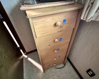 Nice corner dresser! Looks to be maple! On top, lamp and air purifier! 
