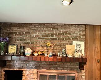 Collectibles and pottery on the beautiful mantle! 