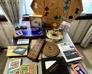 A literal TABLE FULL of games! Many are unopened INCLUDING a handheld Wheel Of Fortune! MIOB Unopened! 1983!
