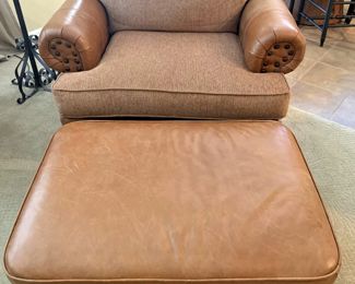 Close-up of the leather and tweed chair with ottoman