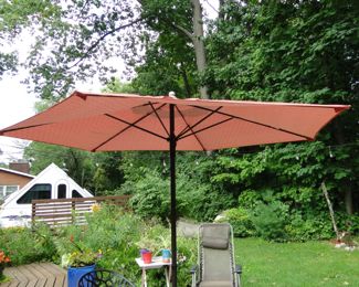 Large stand umbrella, and what a nice yard.