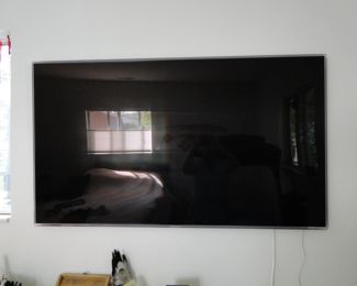 Another large mounted wall TV