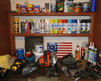 Paint, caulk, and tools, all assembled nicely with lots and lots of tape and putty too