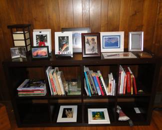 Books, picture frames, lamps and shelving
