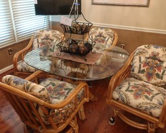 8           glass  top  rattan  dinette set and  four  chairs.  Table  is  44"         