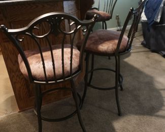 29     Tempo  brand  bar  stools  There  are 4  with  backs  and one  without.  They  swivel.  