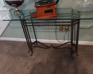 31  Glass  top   library  table    18"  x  60"   The  base  is  metal.    
