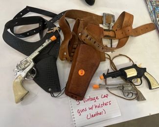 THREE VINTAGE CAP GUNS WITH HOLSTERS