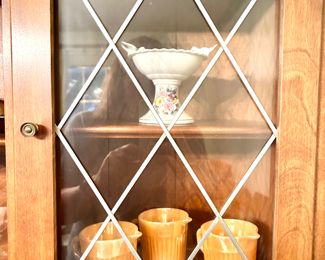 Ethan Allen breakfront with two leaded glass upper cabinets, 8 drawers (including silver drawer), plate display, wine glass holders, hidden storage in lower cabinets.