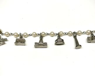 Large selection of jewelry, including charm bracelets with 1970s/80s silver Washington DC monument charms