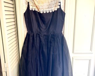 Vintage clothing, including 1960s black party dress with white lace and bow details