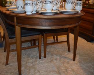 MCM Dining Room Suite by Lane Company, Alta Vista, consists of Beautiful Dining Room Table with leaf ( 80" in length), 6 Side Chairs, 2 Captain's Chairs - Gorgeous China Cupboard consisting of lighted China Cupboard and Buffet with 3 Center Drawers and Linen Fold Cupboard Doors on each side ( Immaculate!) The height is 6' 1 1/2") *plus* Warming Cart with Slide Open Top revealing porcelain food warming plate to keep those hot dishes hot and ready to serve.  The cart is 39 3/4" in length, 21" in depth, 30 1/2" high, Linen Fold Sliding Doors on Bottom and Wheels with "Brass Protectors". This Gorgeous Rare Lane Set will be offered as one complete unit to start with offers taken on individual pieces.