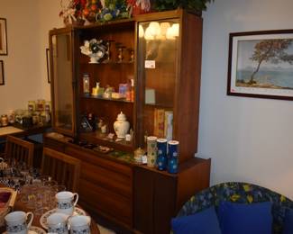 MCM Dining Room Suite by Lane Company, Alta Vista, consists of Beautiful Dining Room Table with leaf ( 80" in length), 6 Side Chairs, 2 Captain's Chairs - Gorgeous China Cupboard consisting of lighted China Cupboard and Buffet with 3 Center Drawers and Linen Fold Cupboard Doors on each side ( Immaculate!) The height is 6' 1 1/2") *plus* Warming Cart with Slide Open Top revealing porcelain food warming plate to keep those hot dishes hot and ready to serve.  The cart is 39 3/4" in length, 21" in depth, 30 1/2" high, Linen Fold Sliding Doors on Bottom and Wheels with "Brass Protectors". This Gorgeous Rare Lane Set will be offered as one complete unit to start with offers taken on individual pieces.