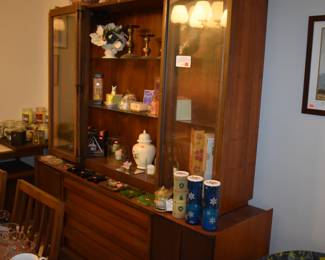 MCM Dining Room Suite by Lane Company, Alta Vista, consists of Beautiful Dining Room Table with leaf ( 80" in length), 6 Side Chairs, 2 Captain's Chairs - Gorgeous China Cupboard consisting of lighted China Cupboard and Buffet with 3 Center Drawers and Linen Fold Cupboard Doors on each side ( Immaculate!) The height is 6' 1 1/2") *plus* Warming Cart with Slide Open Top revealing porcelain food warming plate to keep those hot dishes hot and ready to serve.  The cart is 39 3/4" in length, 21" in depth, 30 1/2" high, Linen Fold Sliding Doors on Bottom and Wheels with "Brass Protectors". This Gorgeous Rare Lane Set will be offered as one complete unit to start with offers taken on individual pieces.