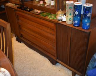 MCM Dining Room Suite by Lane Company, Alta Vista, consists of Beautiful Dining Room Table with leaf ( 80" in length), 6 Side Chairs, 2 Captain's Chairs - Gorgeous China Cupboard consisting of lighted China Cupboard and Buffet with 3 Center Drawers and Linen Fold Cupboard Doors on each side ( Immaculate!) The height is 6' 1 1/2") *plus* Warming Cart with Slide Open Top revealing porcelain food warming plate to keep those hot dishes hot and ready to serve.  The cart is 39 3/4" in length, 21" in depth, 30 1/2" high, Linen Fold Sliding Doors on Bottom and Wheels with "Brass Protectors". This Gorgeous Rare Lane Set will be offered as one complete unit to start with offers taken on individual pieces.