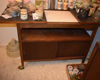 MCM Dining Room Suite by Lane Company, Alta Vista, consists of Beautiful Dining Room Table with leaf ( 80" in length), 6 Side Chairs, 2 Captain's Chairs - Gorgeous China Cupboard consisting of lighted China Cupboard and Buffet with 3 Center Drawers and Linen Fold Cupboard Doors on each side ( Immaculate!) The height is 6' 1 1/2") *plus* Warming Cart with Slide Open Top revealing porcelain food warming plate to keep those hot dishes hot and ready to serve.  The cart is 39 3/4" in length, 21" in depth, 30 1/2" high, Linen Fold Sliding Doors on Bottom and Wheels with "Brass Protectors". This Gorgeous Rare Lane Set will be offered as one complete unit to start with offers taken on individual pieces.