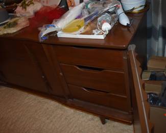 Mid Century Modern Walnut Bedroom Suite featuring Queen Bed with "brutalist" style Head Board, Large Mirrored Dresser with Linen Fold Side Doors with with 3 Pull Out Drawers on each side,  and 4 large Center Drawers, plus Fabulous Linen Fold Chest featuring Linen Fold top drawers opening  up to 4 Pull Out Drawers ( 2 to each side) with 3 large Dresser Drawers on the bottom, plus 2 Matching Beautiful Night Stands.