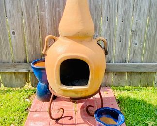 Terra cotta chiminea on stand