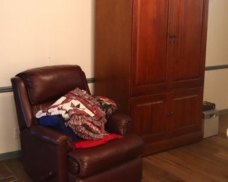 Leather recliner ($50), Cherry entertainment center ($250)