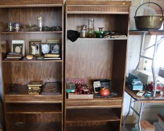 Bookcases ($25), glass and picture frames ($1-5), brass jam pail ($25), glass demijohn ($50)
