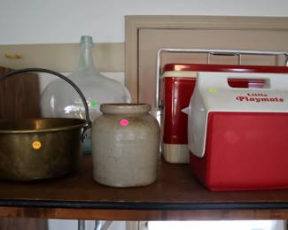 Brass jam pail ($25), glass demijohn ($50), stoneware crock ($10), Playmate cooler ($1), vintage Coleman cooler ($25)