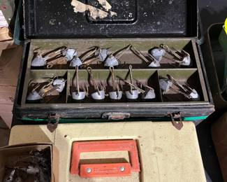Metal Tacklebox including weighted triple hooks.