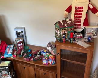 Entertainment center with some holiday decorations.