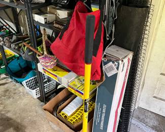 Tamper, full roll of plastic, weed barrier and plastic fencing.