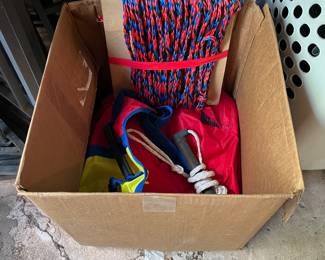 Inflatable raft and rope to pull behind boat.